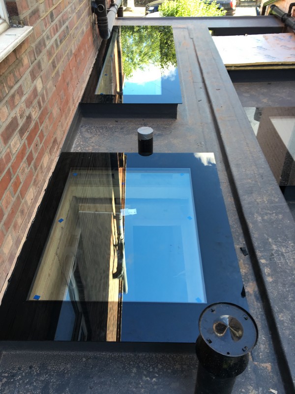 Multiple flat roof skylights on extension in Wokingham
