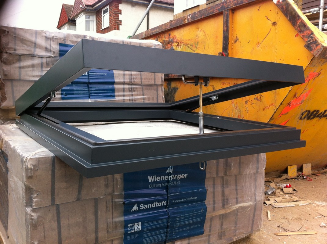 Opening flat roof skylight in anthracite grey installed in Wokingham